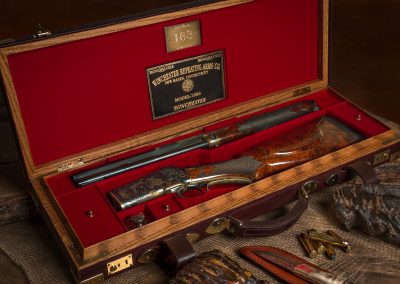 Restored, converted and upgraded antique Winchester 1886 in .50-110. Red felt lined oak and leather case reworked by David Bennett.