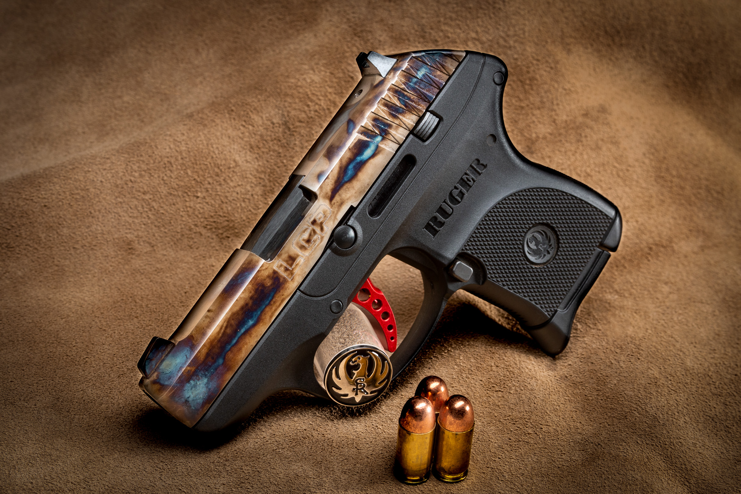 Photo of a factory-new Ruger LCP, featuring bone charcoal color case hardened slide by Turnbull Restoration