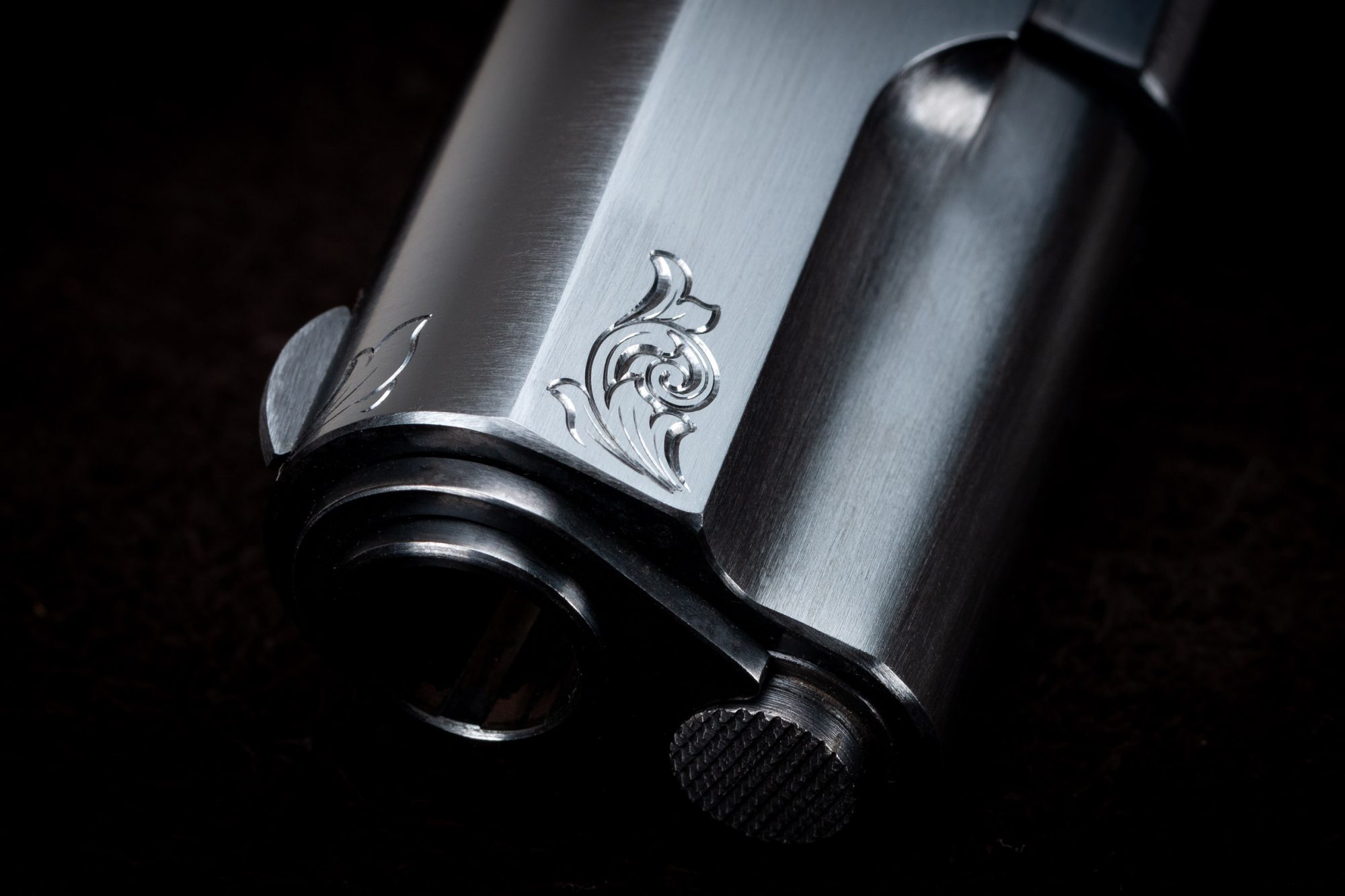 Photo of a Turnbull-made Model 1911 replica pistol, featuring hand engraving and period-correct charcoal bluing