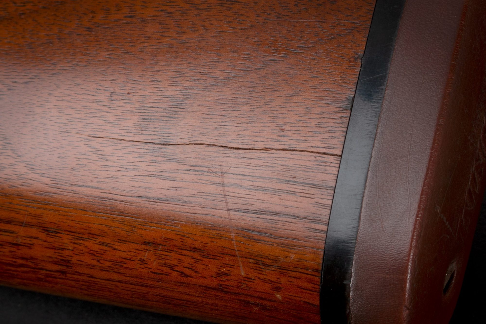Photo of scratches on a pre-owned Winchester Model 12 pump action 12 gauge shotgun, sold as-is by Turnbull Restoration