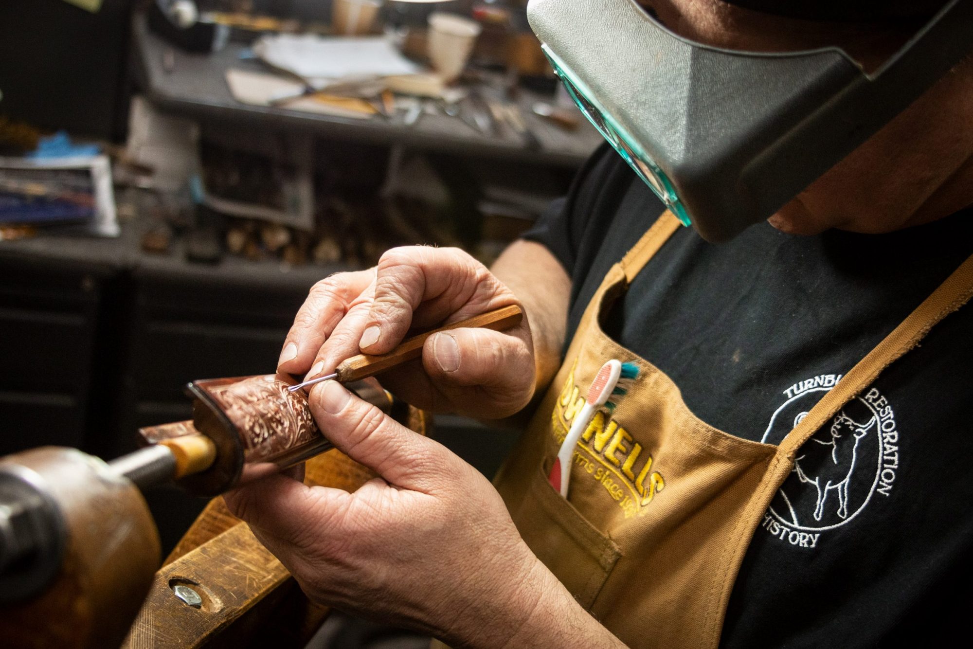 Photo of forend carving on a fully restored Winchester Model 1892 from 1914, performed by Turnbull Restoration in Bloomfield, NY