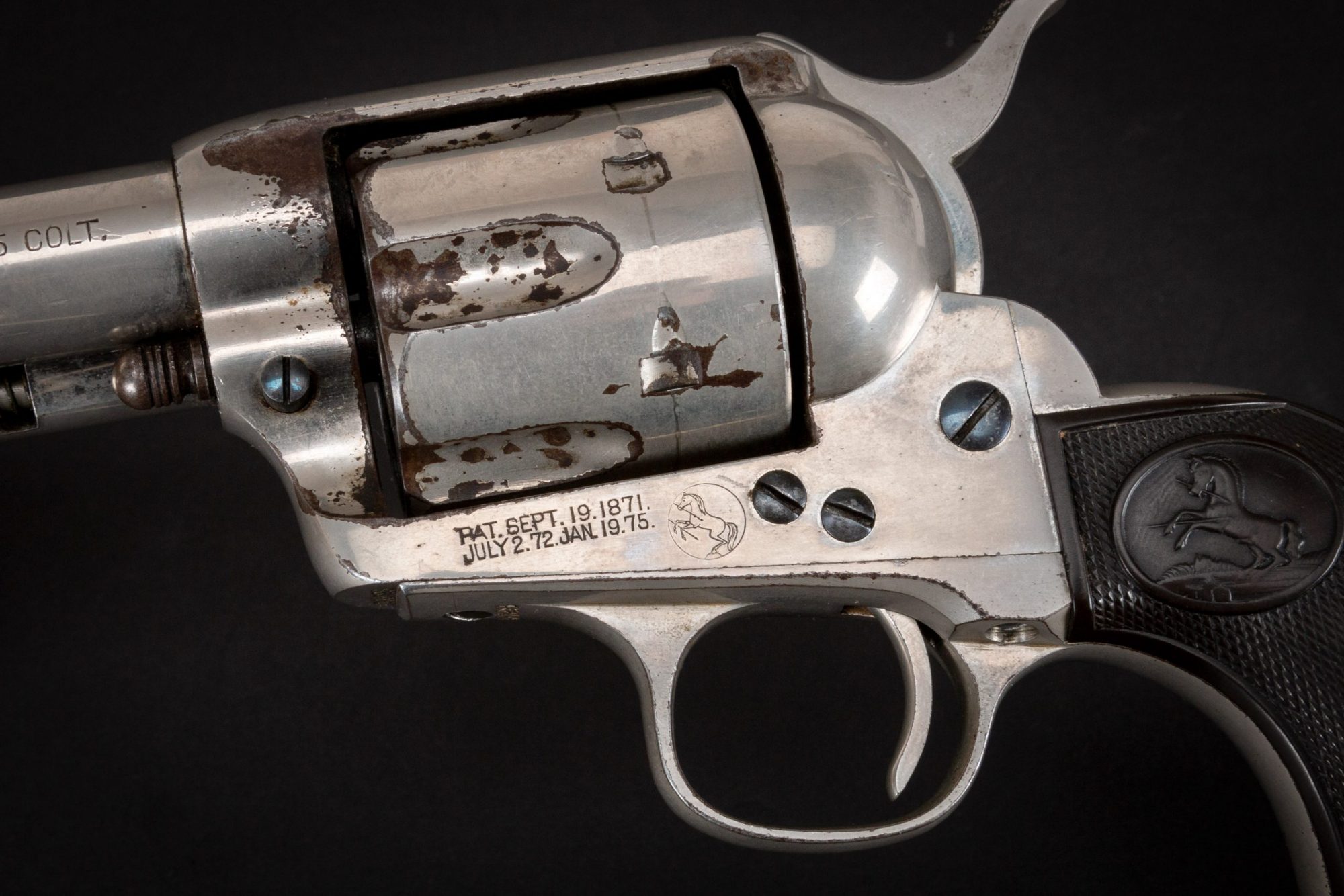 Photo of a first generation Colt Single Action Army revolver from 1897, with original nickel and nitre finishes