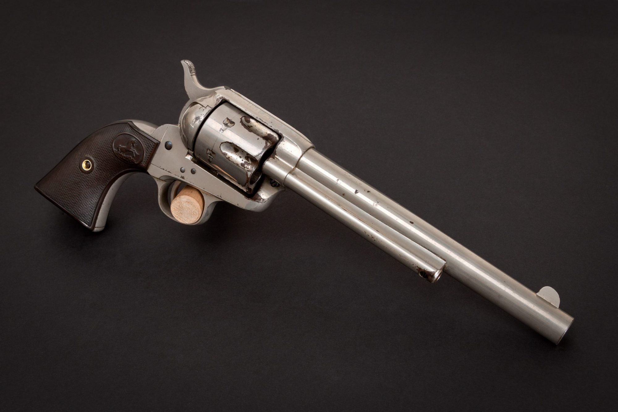 Photo of a first generation Colt Single Action Army revolver from 1897, with original nickel and nitre finishes