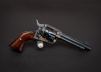 Photo of a Ruger New Vaquero revolver, featuring engraving and bone charcoal color case hardening by Turnbull Restoration of Bloomfield, NY