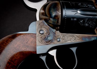 Photo of a Ruger New Vaquero revolver, featuring engraving and bone charcoal color case hardening by Turnbull Restoration of Bloomfield, NY