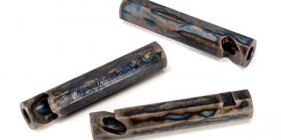 Photo of color case hardened bottle openers, featuring traditional bone charcoal color case hardening by Turnbull Restoration