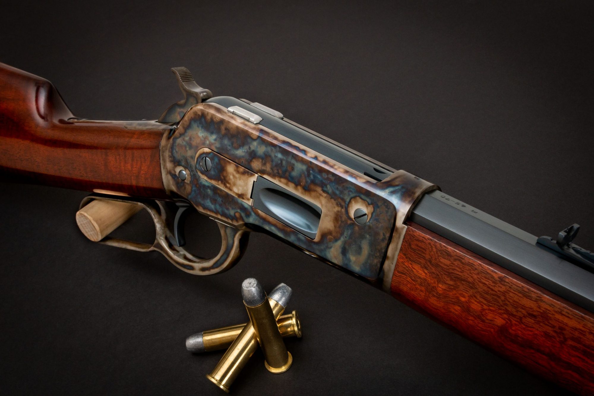 Photo of a Winchester Model 1886 reproduction - The Turnbull Restoration Model 1886 features classic era metal finishes including bone charcoal color case hardening, charcoal bluing and rust bluing
