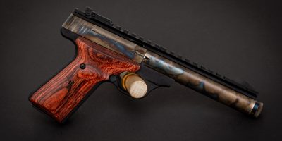 Photo of a color case hardened Browning Buck Mark Field Target with threaded barrel, featuring bone charcoal color case hardening by Turnbull Restoration of Bloomfield, NY