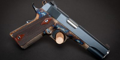 Photo of a Turnbull Government Heritage Model 1911, featuring color case hardened frame along with charcoal blued slide and parts