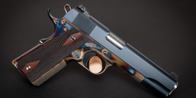 Photo of a Turnbull Government Heritage Model 1911, featuring color case hardened frame along with charcoal blued slide and parts