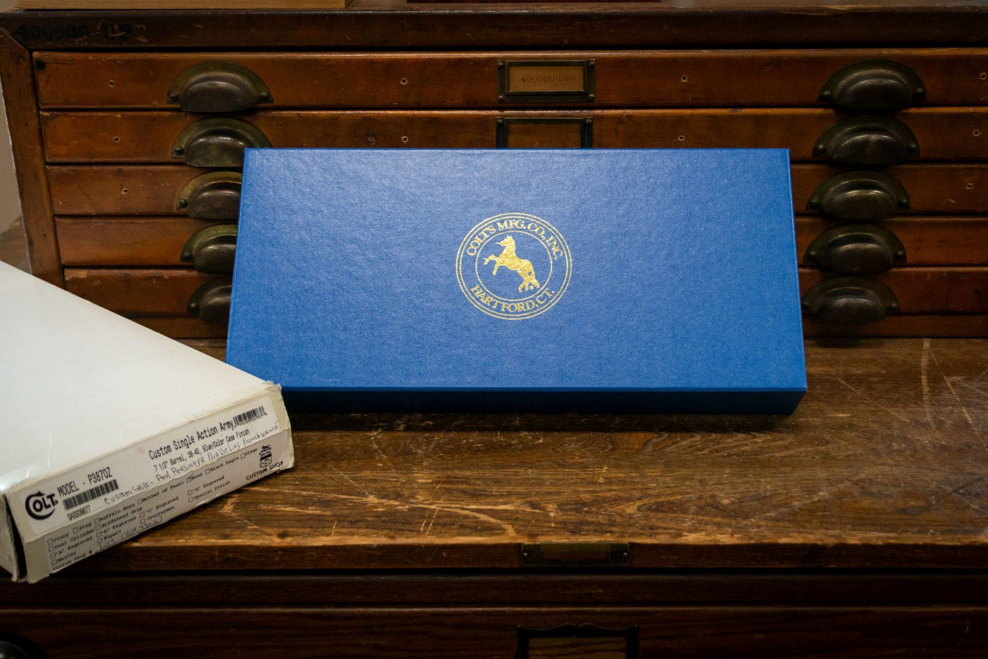 Photo of the original box for a SASS Third-Generation Colt SAA, featuring restoration-grade metal finishes by Turnbull Restoration of Bloomfield, NY