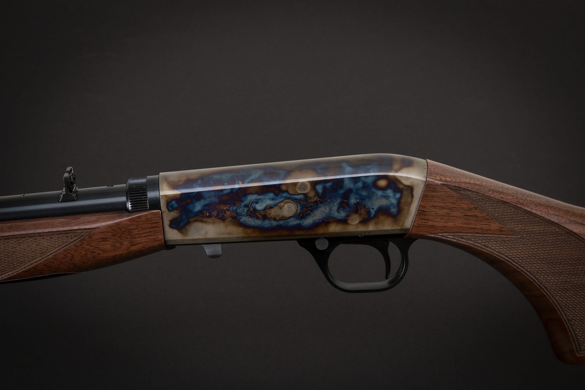 Photo of a color case hardened Browning SA-22 rifle, featuring bone charcoal color case hardening by Turnbull Restoration of Bloomfield, NY