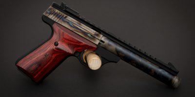 Photo of a color case hardened Browning Buck Mark Field Target Suppressor Ready pistol, featuring bone charcoal color case hardening by Turnbull Restoration of Bloomfield, NY