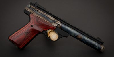 Photo of a color case hardened Browning Buck Mark Field Target Suppressor Ready pistol, featuring bone charcoal color case hardening by Turnbull Restoration of Bloomfield, NY