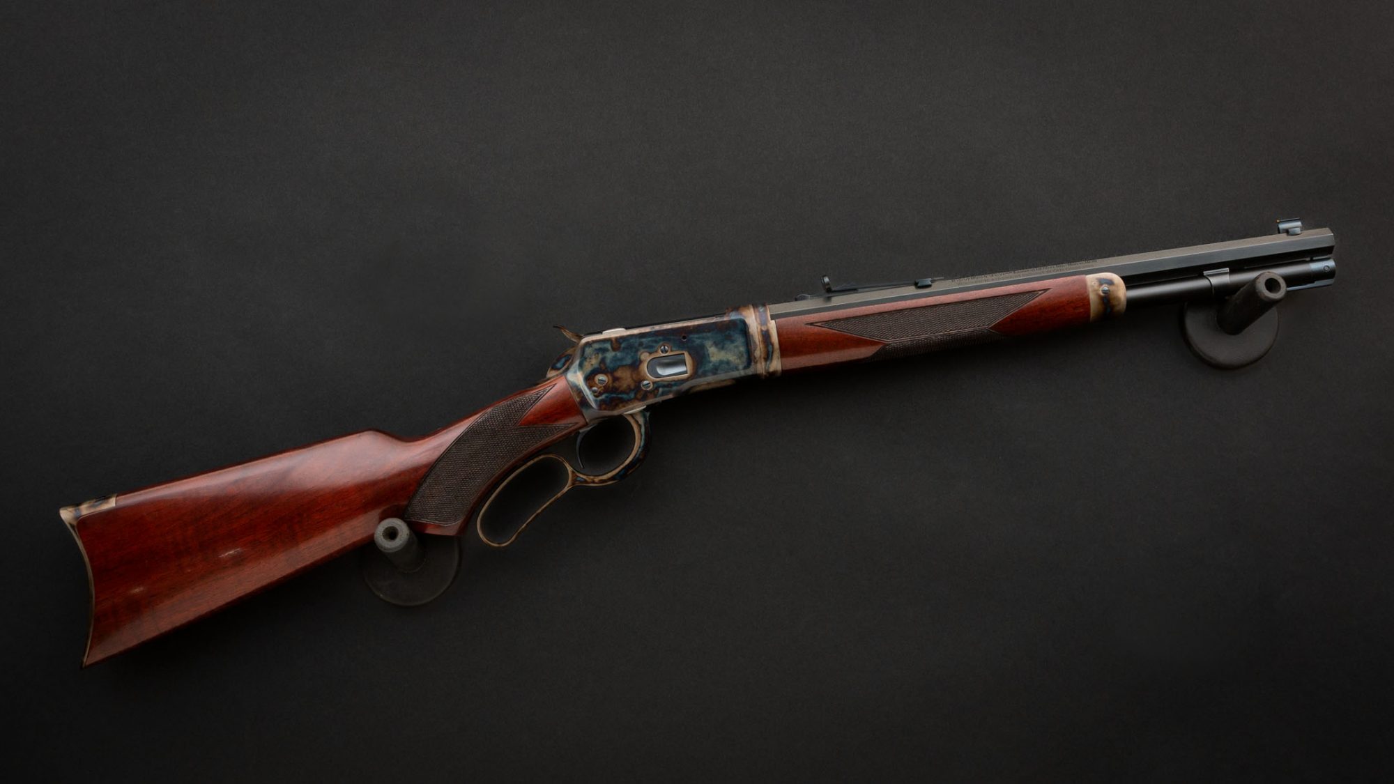 Photo of a color case hardened Winchester 1892 Trapper Takedown rifle, featuring bone charcoal color case hardening, charcoal bluing and rust bluing by Turnbull Restoration of Bloomfield, NY