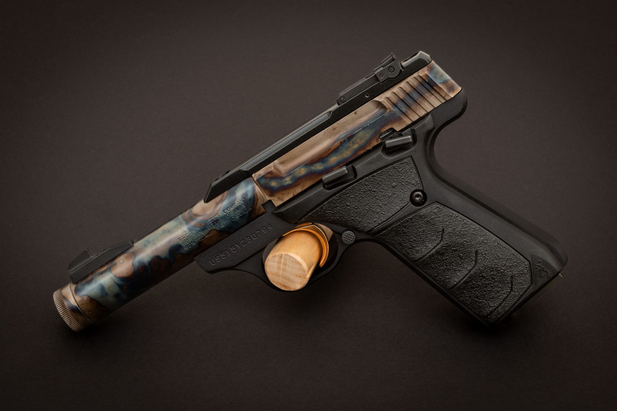 Photo of a color case hardened Browning Buck Mark Micro Bull Suppressor Ready pistol, featuring bone charcoal color case hardening by Turnbull Restoration of Bloomfield, NY