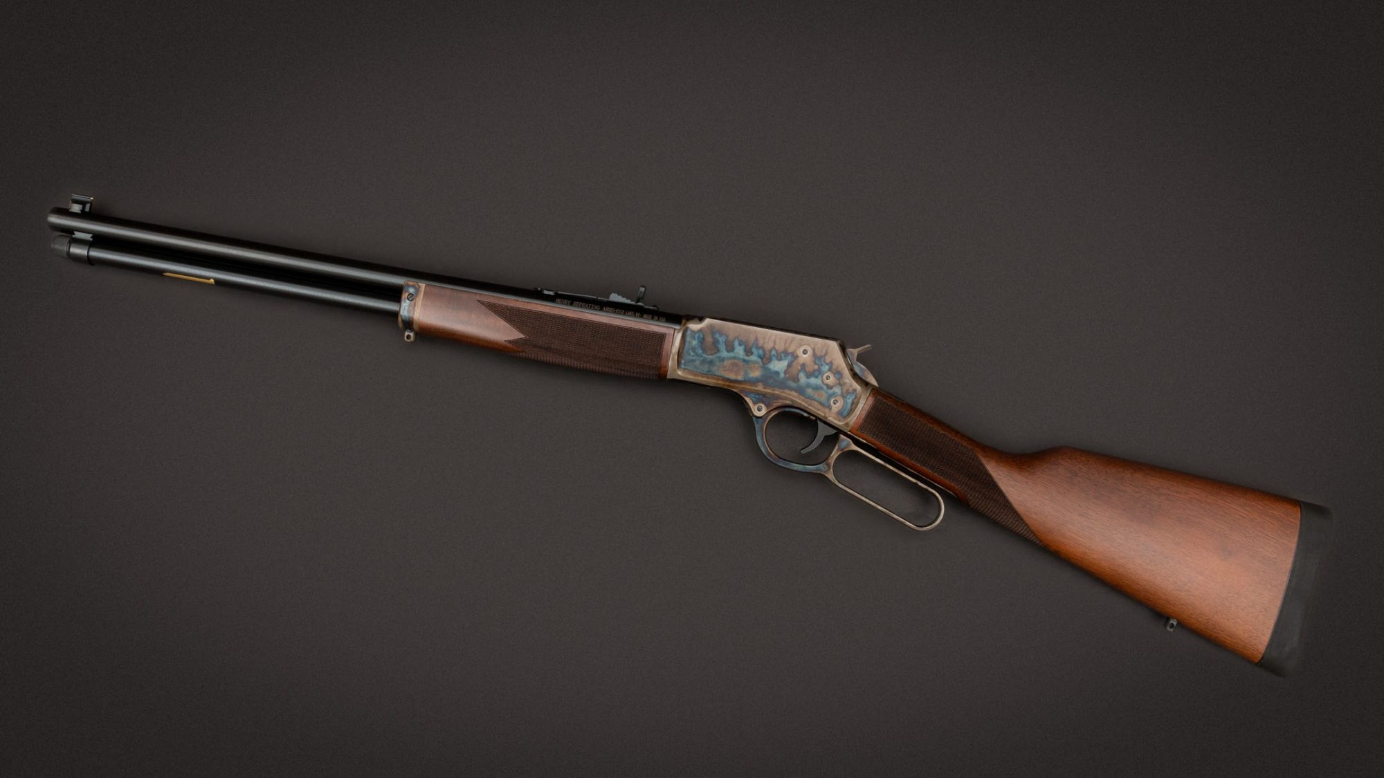 Photo of a color case hardened Henry Side Loading Gate rifle, featuring bone charcoal color case hardening by Turnbull Restoration of Bloomfield, NY