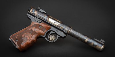Ruger Mark IV Target with wood laminate grips, featuring bone charcoal color case hardening by Turnbull Restoration