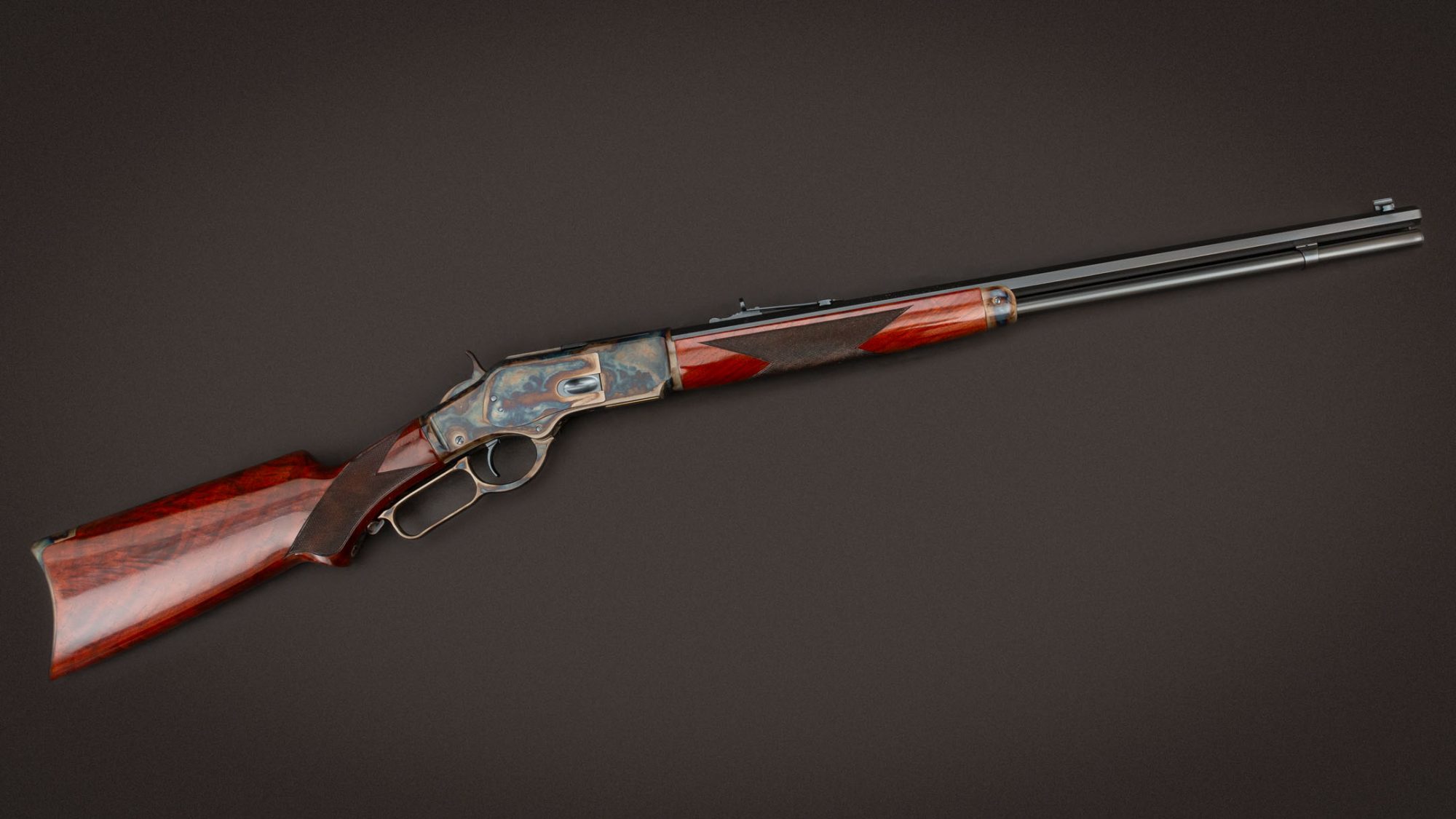 Winchester 1873 featuring engraving, wood finish, and metal finishes by Turnbull Restoration
